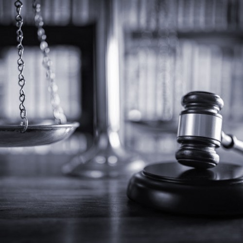 Gavel and scales in a legal setting.